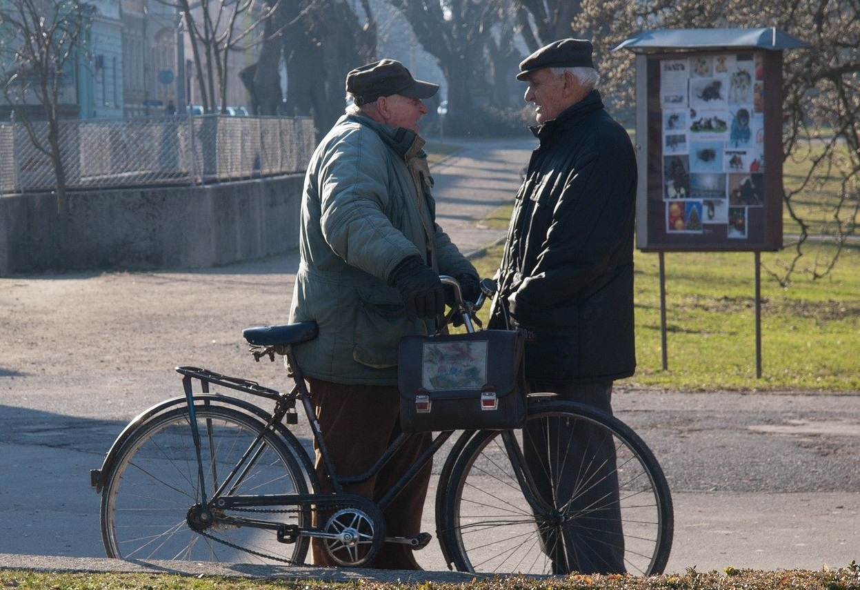 two older men talking